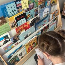 girl selecting a book 